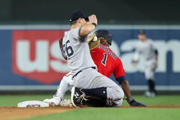 LeMahieu of the New York Yankees fields the ball as Nick Gordon of the Minnesota Twins steals second base in the seventh inning of the game at Target...