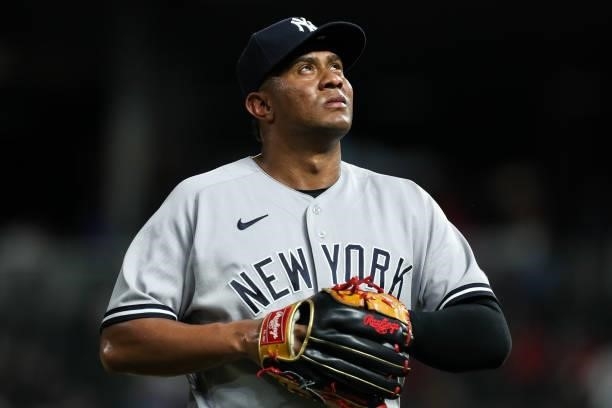 Wandy Peralta of the New York Yankees walks back to the dugout after being replaced against the Minnesota Twins in the seventh inning of the game at...
