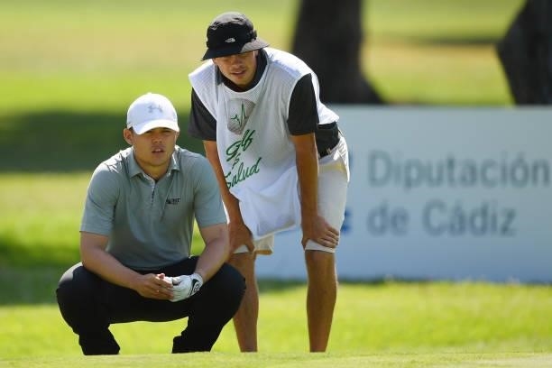 Kristof Ulenaers of Belgium with his caddie lines before putts on the fifteen hole during Day Two of the Challenge de Cadiz at Iberostar Real Club de...