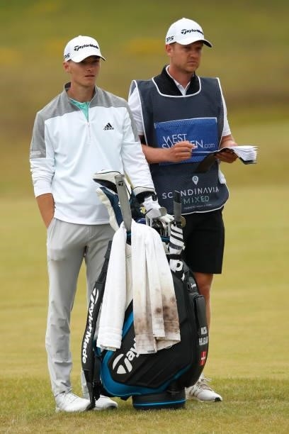 Nicolai Hojgaard of Denmark waits with caddie on the 12th hole during the second round of The Scandinavian Mixed Hosted by Henrik and Annika at...