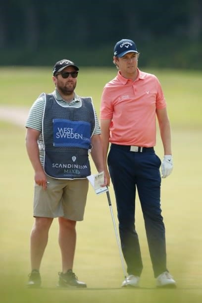 Steven Brown of England looks on with caddie on the 2nd hole during the second round of The Scandinavian Mixed Hosted by Henrik and Annika at Vallda...