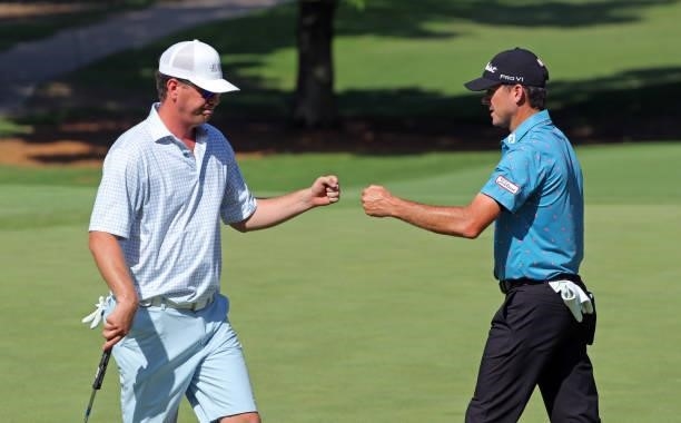 Brian Lemons and Wade Binfield fist bump on the 10th hole during the second round of the BMW Charity Pro-Am presented by Synnex Corporation at the...