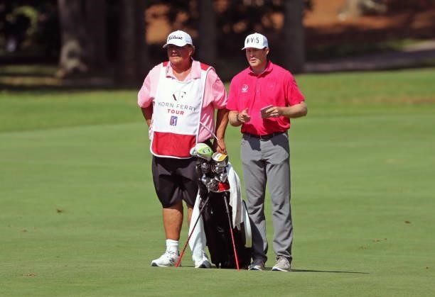 Kyle Reifers and his caddie stand in the fairway on the 10th hole during the second round of the BMW Charity Pro-Am presented by Synnex Corporation...