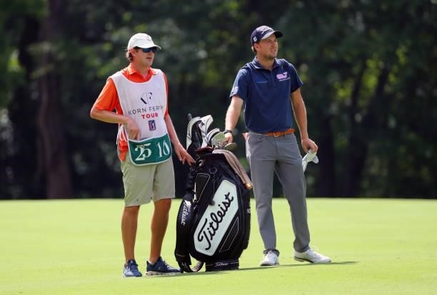Lee Hodges and his caddie stand in the fairway on the 12th hole during the second round of the BMW Charity Pro-Am presented by Synnex Corporation at...
