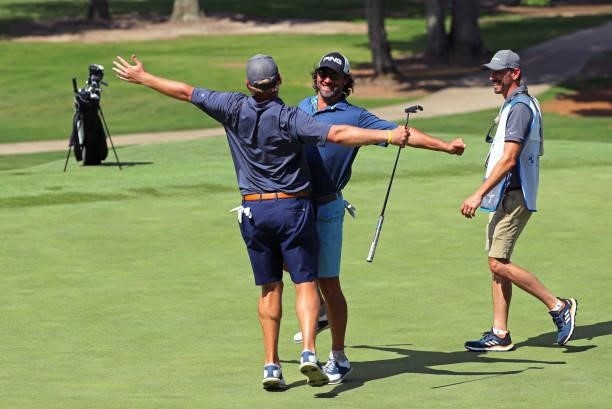 Steven Bright and Dr. Jeff Harris chest bump on the 10th hole during the second round of the BMW Charity Pro-Am presented by Synnex Corporation at...