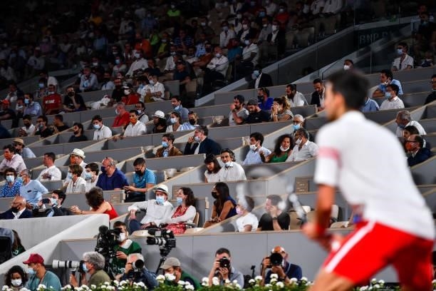 Fans watch the game from the stands during the ninth round of Roland Garros at Roland Garros on June 11, 2021 in Paris, France.