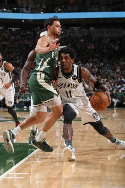 Kyrie Irving of the Brooklyn Nets dribbles the ball during Round 2, Game 3 of the 2021 NBA Playoffs on June 10, 2021 at the Fiserv Forum Center in...