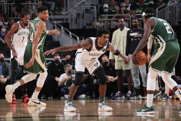 Kyrie Irving of the Brooklyn Nets plays defense on Jrue Holiday of the Milwaukee Bucks during Round 2, Game 3 of the 2021 NBA Playoffs on June 10,...