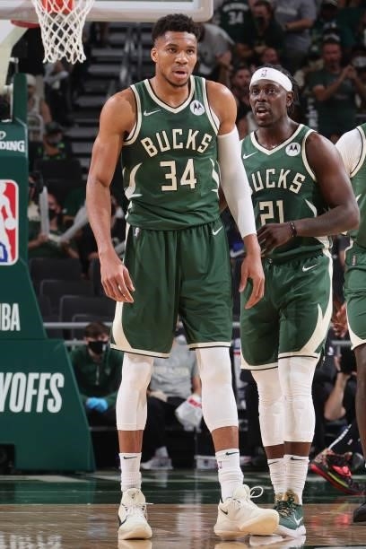 Giannis Antetokounmpo and Jrue Holiday of the Milwaukee Bucks talk during Round 2, Game 3 of the 2021 NBA Playoffs on June 10, 2021 at the Fiserv...