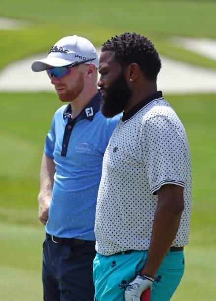 Anders Albertson and Anthony Anderson stand on the green on the 10th hole during the second round of the BMW Charity Pro-Am presented by Synnex...