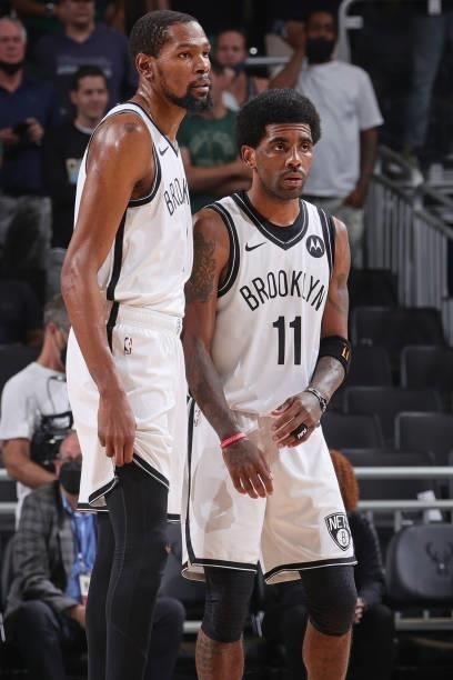 Kevin Durant and Kyrie Irving of the Brooklyn Nets look on during Round 2, Game 3 of the 2021 NBA Playoffs on June 10, 2021 at the Fiserv Forum...