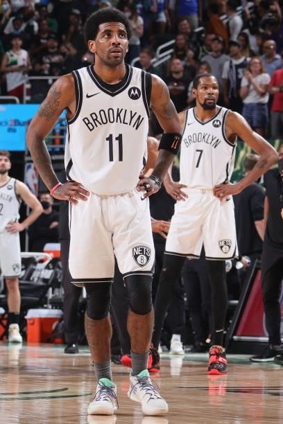 Kyrie Irving and Kevin Durant of the Brooklyn Nets look on during Round 2, Game 3 of the 2021 NBA Playoffs on June 10, 2021 at the Fiserv Forum...