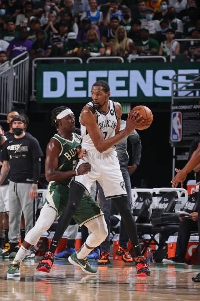 Jrue Holiday of the Milwaukee Bucks plays defense on Kevin Durant of the Brooklyn Nets during Round 2, Game 3 of the 2021 NBA Playoffs on June 10,...