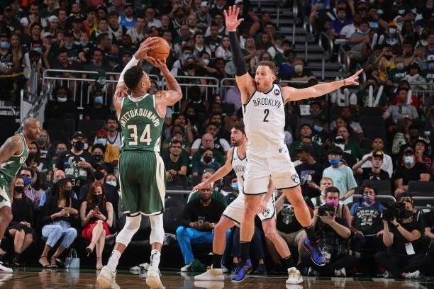 Blake Griffin of the Brooklyn Nets plays defense on Giannis Antetokounmpo of the Milwaukee Bucks during Round 2, Game 3 of the 2021 NBA Playoffs on...