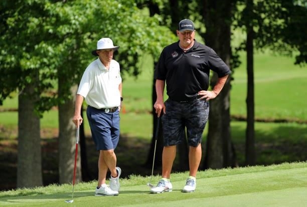Jackson Hughes and Roger Clemens stand on the green on the 12th hole during the second round of the BMW Charity Pro-Am presented by Synnex...