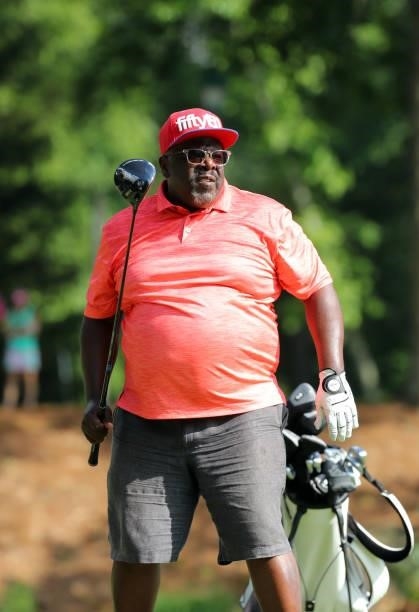 Cedric the Entertainer watches his tee shot on the fifth hole during the second round of the BMW Charity Pro-Am presented by Synnex Corporation at...