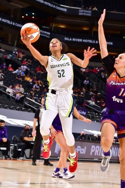 Tyasha Harris of the Dallas Wings drives to the basket against the Phoenix Mercury on June 11, 2021 at Phoenix Suns Arena in Phoenix, Arizona. NOTE...