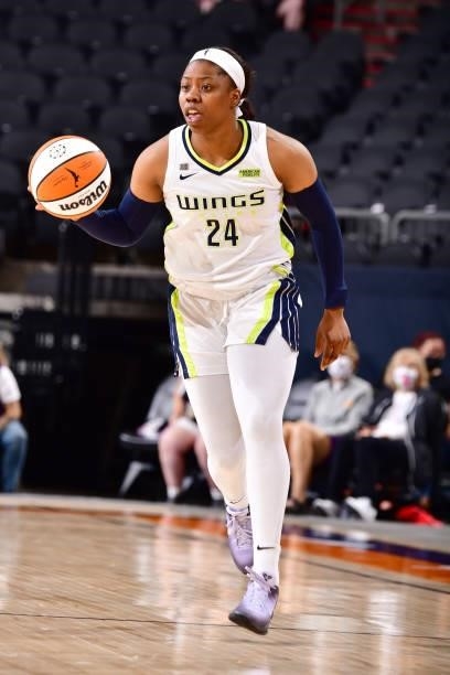 Arike Ogunbowale of the Dallas Wings handles the ball against the Phoenix Mercury on June 11, 2021 at Phoenix Suns Arena in Phoenix, Arizona. NOTE TO...