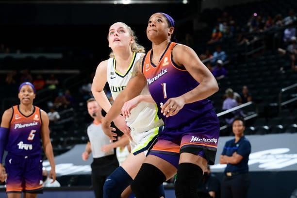 Bella Alarie of the Dallas Wings and Kia Vaughn of the Phoenix Mercury fight for position during the game on June 11, 2021 at Phoenix Suns Arena in...