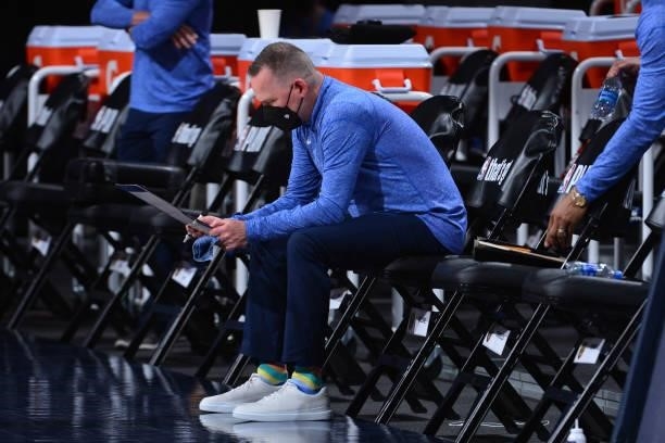 Head Coach Michael Malone of the Denver Nuggets reads before the game against the Phoenix Suns during Round 2, Game 3 of the 2021 NBA Playoffs on...