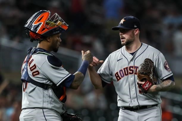 Martin Maldonado and Ryan Pressly of the Houston Astros celebrate their victory against the Minnesota Twins at Target Field on June 11, 2021 in...