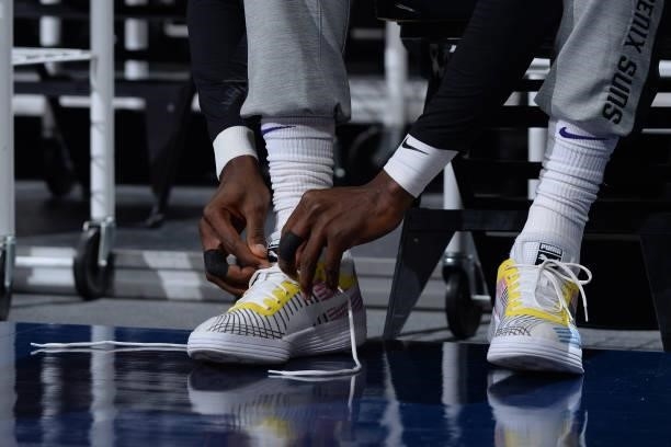 Deandre Ayton of the Phoenix Suns ties his sneakers before the game against the Denver Nuggets during Round 2, Game 3 of the 2021 NBA Playoffs on...