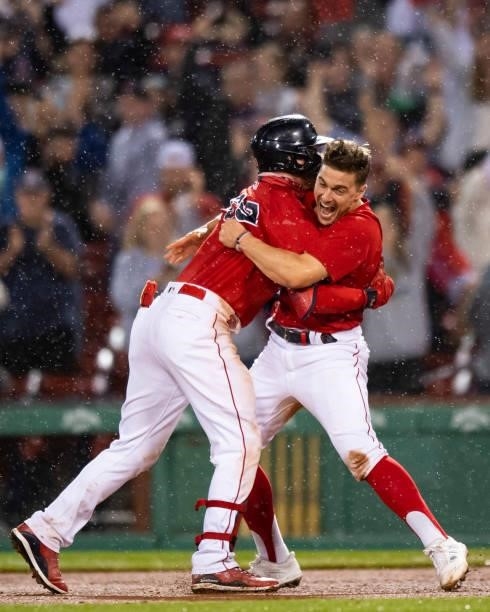 Alex Verdugo of the Boston Red Sox reacts with Enrique Hernandez after hitting a game winning walk-off RBI single during the ninth inning of a game...