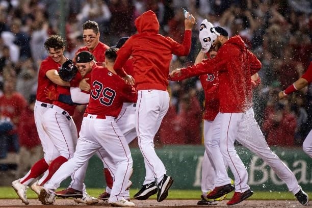 Alex Verdugo of the Boston Red Sox reacts with teammates after hitting a game winning walk-off RBI single during the ninth inning of a game against...