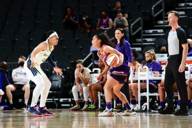 Skylar Diggins-Smith of the Phoenix Mercury handles the ball during the game as Allisha Gray of the Dallas Wings plays defense on June 11, 2021 at...