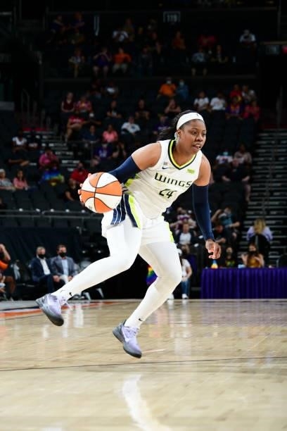 Arike Ogunbowale of the Dallas Wings handles the ball during the game against the Phoenix Mercury on June 11, 2021 at Phoenix Suns Arena in Phoenix,...