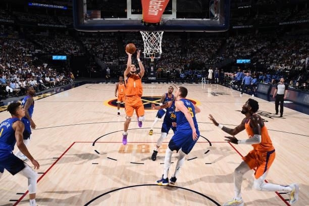Devin Booker of the Phoenix Suns shoots the ball against the Denver Nuggets during Round 2, Game 3 of the 2021 NBA Playoffs on June 11, 2021 at the...