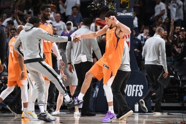 Langston Galloway and Devin Booker of the Phoenix Suns celebrate after the game against the Denver Nuggets during Round 2, Game 3 of the 2021 NBA...