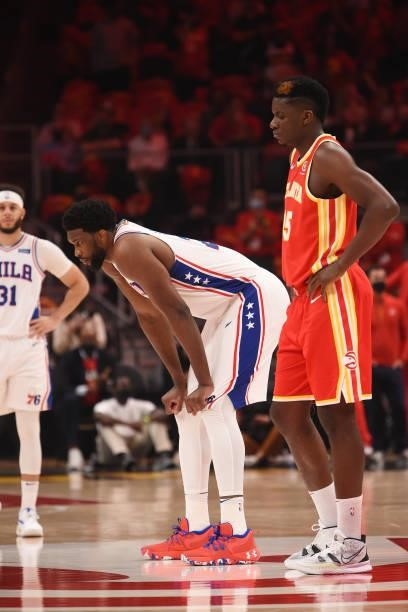Joel Embiid of the Philadelphia 76ers and Clint Capela of the Atlanta Hawks look on during Round 2, Game 3 of the Eastern Conference Playoffs on June...