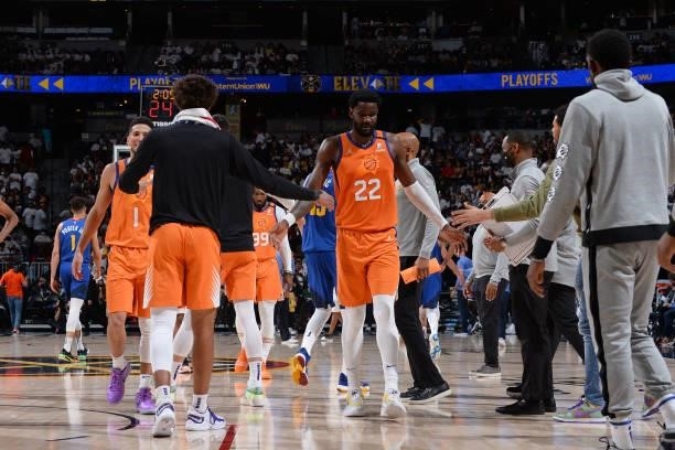 Deandre Ayton of the Phoenix Suns high-fives teammates during the game against the Denver Nuggets during Round 2, Game 3 of the 2021 NBA Playoffs on...
