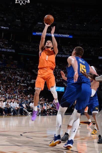 Devin Booker of the Phoenix Suns shoots the ball during the game against the Denver Nuggets during Round 2, Game 3 of the 2021 NBA Playoffs on June...