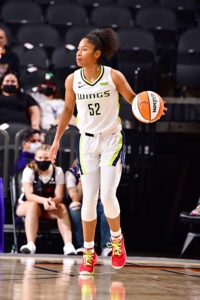 Tyasha Harris of the Dallas Wings handles the ball against the Phoenix Mercury on June 11, 2021 at Phoenix Suns Arena in Phoenix, Arizona. NOTE TO...