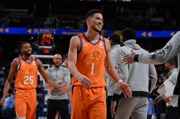 Devin Booker of the Phoenix Suns smiles during the game against the Denver Nuggets during Round 2, Game 3 of the 2021 NBA Playoffs on June 11, 2021...
