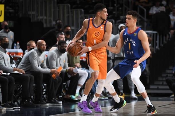 Michael Porter Jr. #1 of the Denver Nuggets plays defense on Devin Booker of the Phoenix Suns during Round 2, Game 3 of the 2021 NBA Playoffs on June...