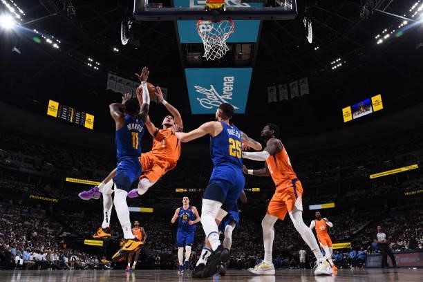 Devin Booker of the Phoenix Suns drives to the basket against the Denver Nuggets during Round 2, Game 3 of the 2021 NBA Playoffs on June 11, 2021 at...