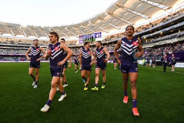 Mitch Crowden and Brandon Walker of the Dockers are happy with their win during the 2021 AFL Round 13 match between the Fremantle Dockers and the...