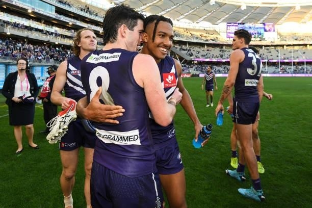 Andrew Brayshaw embraces debutant Brandon Walker of the Dockers during the 2021 AFL Round 13 match between the Fremantle Dockers and the Gold Coast...