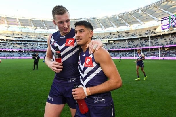 Debutant Joel Western of the Dockers is congratulated by Josh Treacy during the 2021 AFL Round 13 match between the Fremantle Dockers and the Gold...