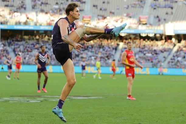 Rory Lobb of the Dockers kicks on goal during the 2021 AFL Round 13 match between the Fremantle Dockers and the Gold Coast Suns at Optus Stadium on...