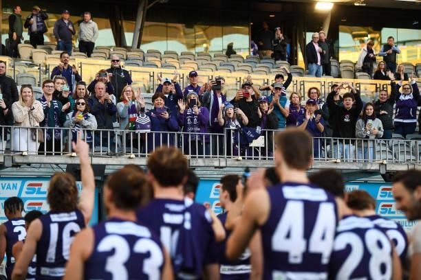 Fremantle fans cheer off their team during the 2021 AFL Round 13 match between the Fremantle Dockers and the Gold Coast Suns at Optus Stadium on June...