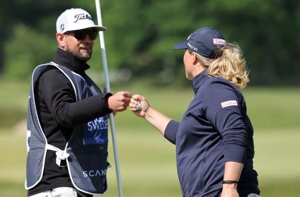 Caroline Hedwall of Sweden reacts with caddie on the 9th hole during the third round of The Scandinavian Mixed Hosted by Henrik and Annika at Vallda...