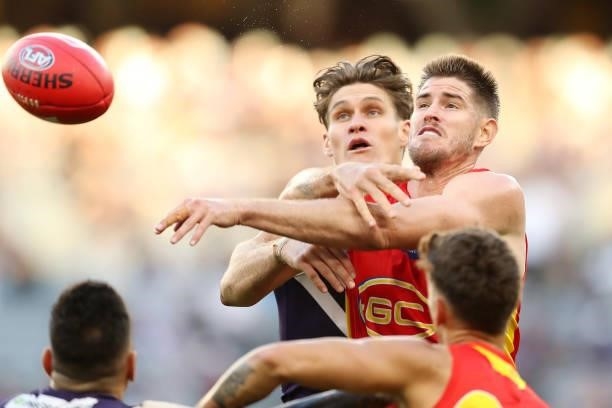 Rory Lobb of the Dockers contests a ruck with Zac Smith of the Suns during the 2021 AFL Round 13 match between the Fremantle Dockers and the Gold...