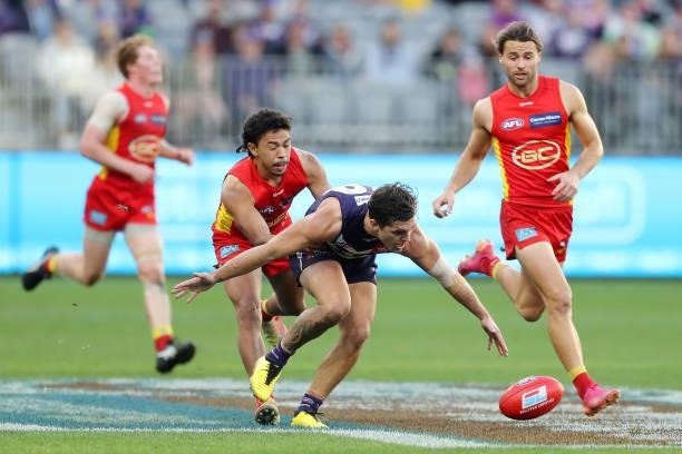 Lachie Schultz of the Dockers chases the ball during the 2021 AFL Round 13 match between the Fremantle Dockers and the Gold Coast Suns at Optus...