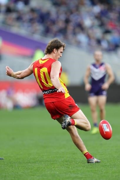 Charlie Ballard of the Suns kicks the ball during the 2021 AFL Round 13 match between the Fremantle Dockers and the Gold Coast Suns at Optus Stadium...