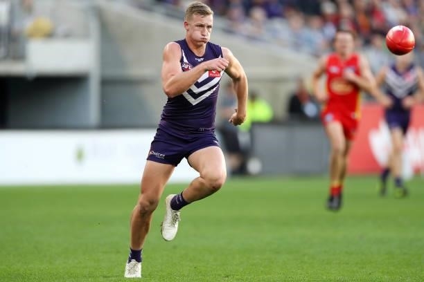Josh Treacy of the Dockers chases the ball during the 2021 AFL Round 13 match between the Fremantle Dockers and the Gold Coast Suns at Optus Stadium...