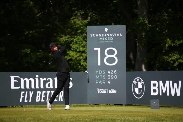 Jonathan Caldwell of Northern Ireland tees off on the 18th hole during the third round of The Scandinavian Mixed Hosted by Henrik and Annika at...
